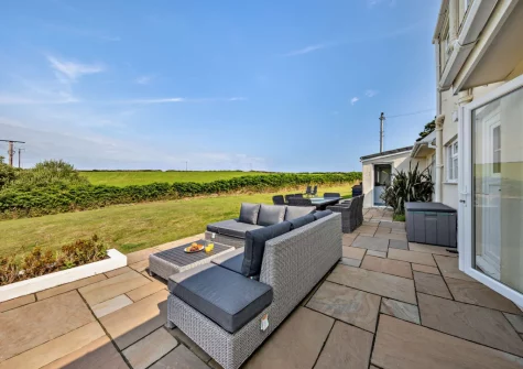 The patio, outdoor sitting, alfresco dining area & enclosed lawned garden at Hillside, Abersoch