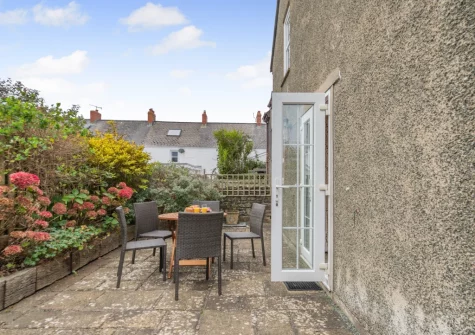 The patio & alfresco dining area at Honeysuckle Cottage, Broad Haven