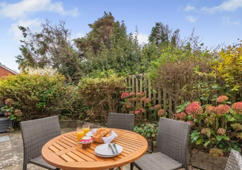 The patio & alfresco dining area at Honeysuckle Cottage, Broad Haven