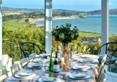 The magnificent coastal view from the conservatory dining area at Hywelfa, Bwlchtocyn