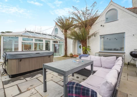 The patio, barbecue, alfresco dining area & hot tub at Hywelfa, Bwlchtocyn
