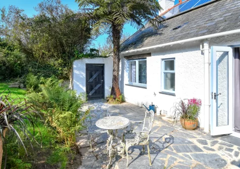 The patio, outdoor sitting area & lawned garden at Hywelfa, Bwlchtocyn