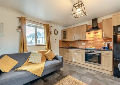 The living area & kitchen at Keepers Cottage at East Tarr Farm, St Florence