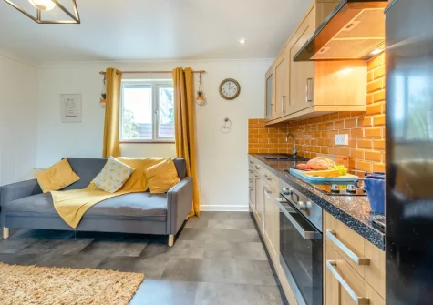 The living area & kitchen at Keepers Cottage at East Tarr Farm, St Florence