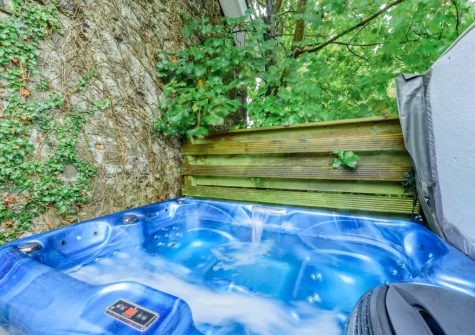 The terrace & hot tub at Keepers Cottage at East Tarr Farm, St Florence