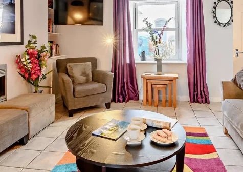 Kiwi Cottage, Tenby is a charming three-bedroom terraced cottage, just steps from the town centre and beautiful beaches. Enjoy a spacious interior, enclosed garden, and direct access to Tenby's delightful coastal charm and vibrant attractions.