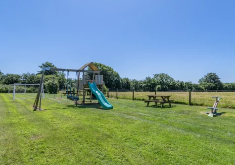 The shared garden, children's play area & picnic benches at Lavender Cottage, Haverfordwest