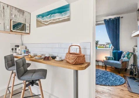 The kitchen with breakfast bar dining area at Lighthouse Row, St Annes Head