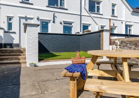 The enclosed terrace & alfresco dining area at Lighthouse Row, St Annes Head