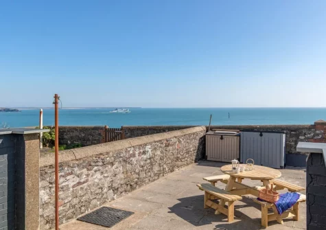 The enclosed terrace & alfresco dining area at Lighthouse Row, St Annes Head