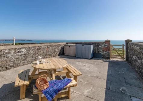 The enclosed terrace & alfresco dining area at Lighthouse Row, St Annes Head