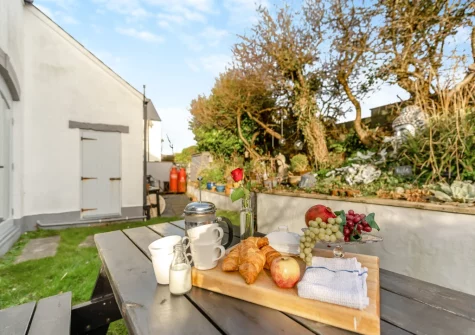 The patio, alfresco dining area & garden at Lily Cottage, Angle
