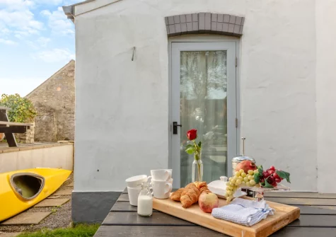 The patio, alfresco dining area & garden at Lily Cottage, Angle