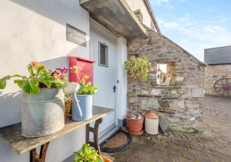 Lily Cottage is a colourful cottage in Angle, featuring a ground-floor bedroom & bathroom