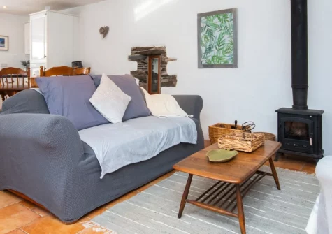 Llety Wen, New Moat is a charming traditional cottage nestled in peaceful Pembrokeshire countryside, featuring a romantic four-poster bedroom, wood burner, and enclosed patio, perfectly placed for exploring coastal treasures and ancient monuments.