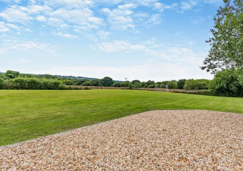 You have access to a shared playing field, barbecue & firepit