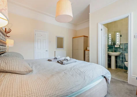 The bedroom & en-suite bathroom at Main Sail, Tenby