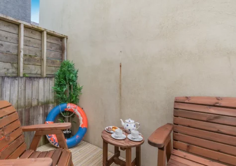 The enclosed courtyard garden & outdoor sitting area at May's Place, Tenby