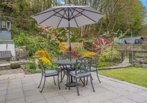 The patio, alfresco dining area & lawned garden at Miners Arms Cottage, Stepaside