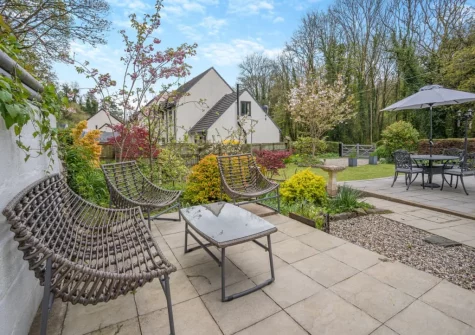 The patio, outdoor sitting area & lawned garden at Miners Arms Cottage, Stepaside