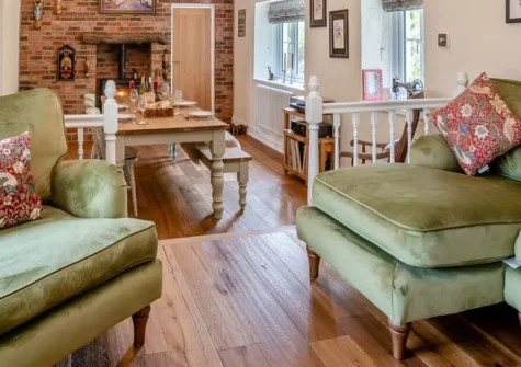 Miners Arms Cottage, Stepaside is a charming two-bedroom retreat with exposed beams and wood burner, set in the peaceful Pembrokeshire village just a 15-minute stroll from Wisemans Bridge beach, featuring an enclosed garden and games room.