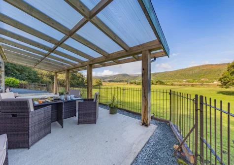 The patio & alfresco dining area at Minffordd, Penmaenpool