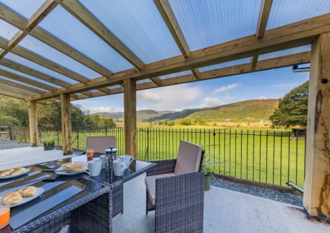 The patio & alfresco dining area at Minffordd, Penmaenpool