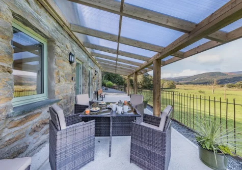 The patio & alfresco dining area at Minffordd, Penmaenpool