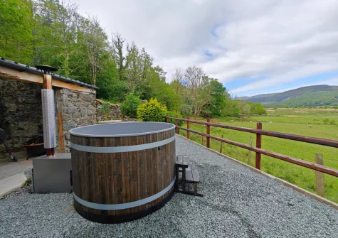 The private wood-fired hot tub at Minffordd, Penmaenpool