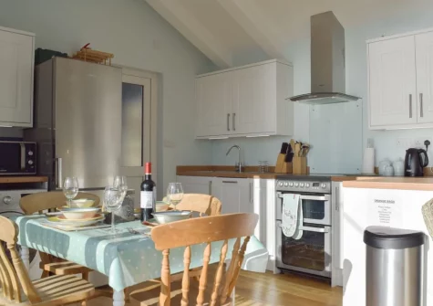 The dining area & kitchen at Mole End, Amroth