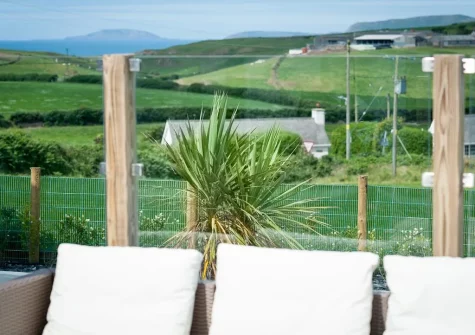 The far-reaching countryside view from the large decked terrace, alfresco dining & outdoor sitting area at Morannedd, Bwlchtocyn