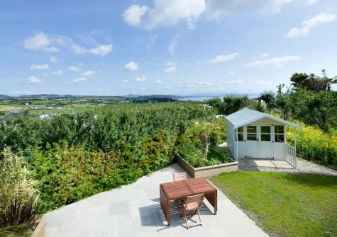 The patio, outdoor sitting area & lawned garden at Morannedd, Bwlchtocyn