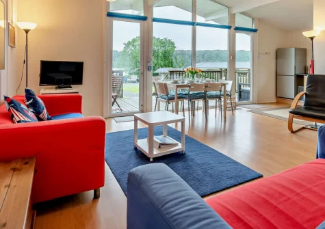 Morning Tide, Burton Ferry is a delightful three-bedroom lodge perched on the Cleddau Estuary in Pembrokeshire, boasting splendid waterside views, direct beach access through a gate, and a sun-drenched terrace perfect for watching boats drift by.