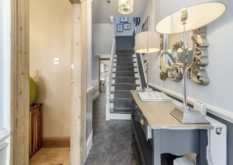 The hallway & stairs up to the first floor at Nelson Cottage, Tenby