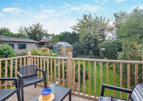 The decked patio & outdoor sitting area at North Bay Bungalow, Rhos on Sea