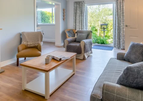 Oak View, Tenby is a welcoming single-storey bungalow on the peaceful outskirts of this beloved Pembrokeshire town, featuring a secure enclosed garden with sunny lawned and gravel areas, comfortable family accommodation, & access to golden beaches.