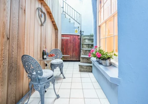 The small courtyard seating area at Ocean Waves, Tenby