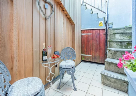 The small courtyard seating area at Ocean Waves, Tenby