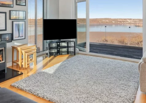 Ocean Way, Pembroke Dock is a spacious four-bedroom waterside home perched above the Milford Haven Waterway, featuring a private hot tub with spectacular views, games room, and generous parking for five cars near Pembrokeshire's finest beaches.