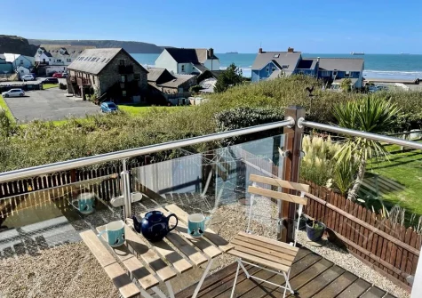 The balcony & outdoor sitting area at Ol Tywydd, Broad Haven
