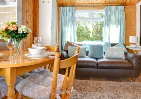 Old Gardeners Lodge, Saundersfoot is a quaint detached cottage on the peaceful village outskirts, featuring rustic country interiors, a delightful shared garden with private patio area, and walks through the woodland to Glen Beach.