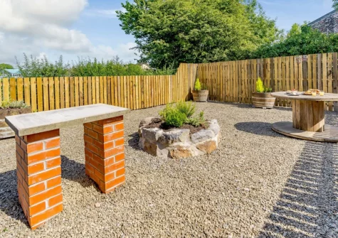 The gravelled garden with barbecue stand, for use with disposable barbecues, at Old Mart Gate House, Narberth