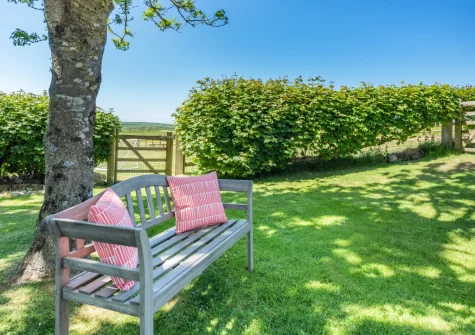 The enclosed lawned garden at Orlandon Farm Cottage, St Brides