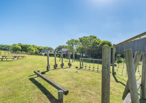 The shared gated children's play area at Orlandon Farm Cottage, St Brides