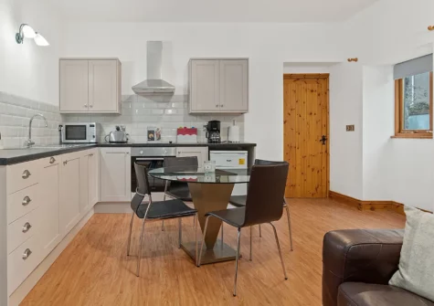 The open-plan kitchen & dining area at Owls Retreat, West Elliamston