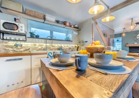The open-plan kitchen & dining area at Oystercatcher Cottage, Llangwm