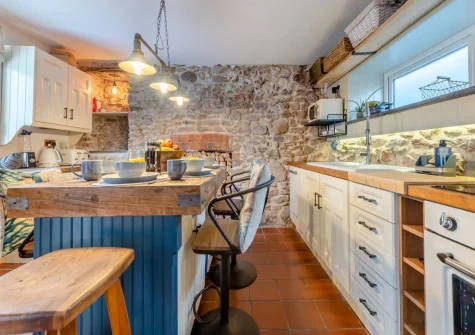 The open-plan kitchen & dining area at Oystercatcher Cottage, Llangwm