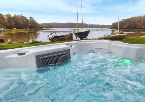 The hot tub overlooking the river at Oystercatcher Cottage, Llangwm