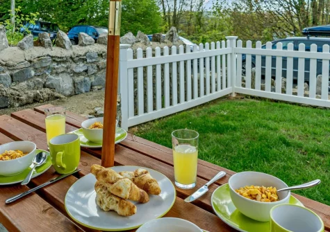 The patio, alfresco dining area & enclosed garden at Park Place Court 3 Plas Bach, Tenby