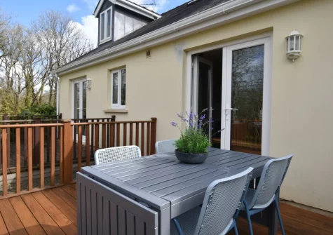 The decked patio & alfresco dining area at Passion Flower Cottage, Redberth